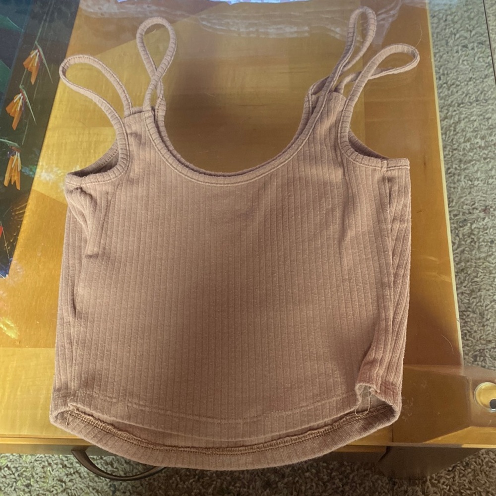 The brand is SO it’s a brown, comfy, scooped neck, tank top